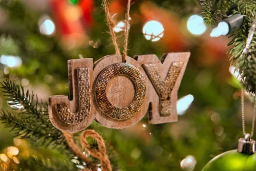 A tree ornament spelling JOY