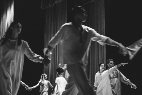 A cast of actors performing