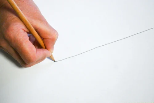 A person drawing a line